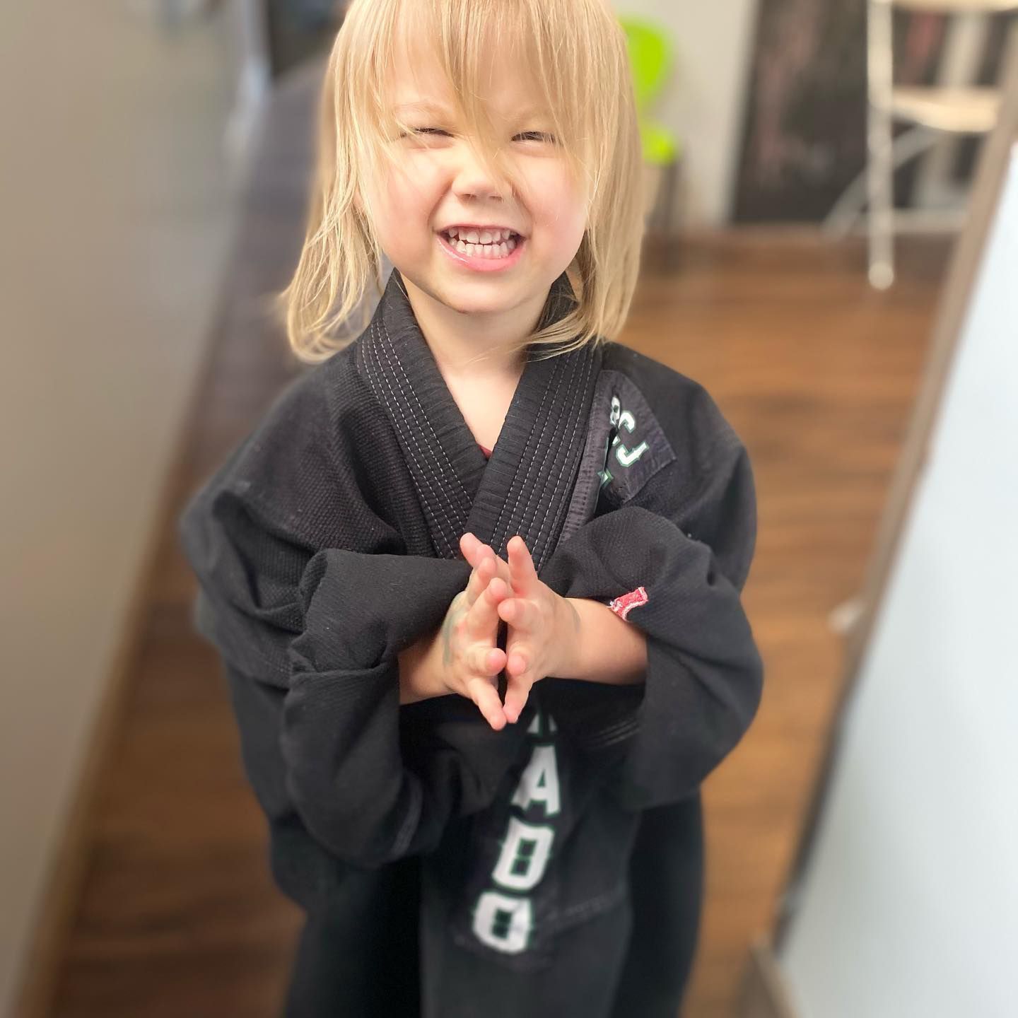 Instructor teaching martial arts techniques to kids