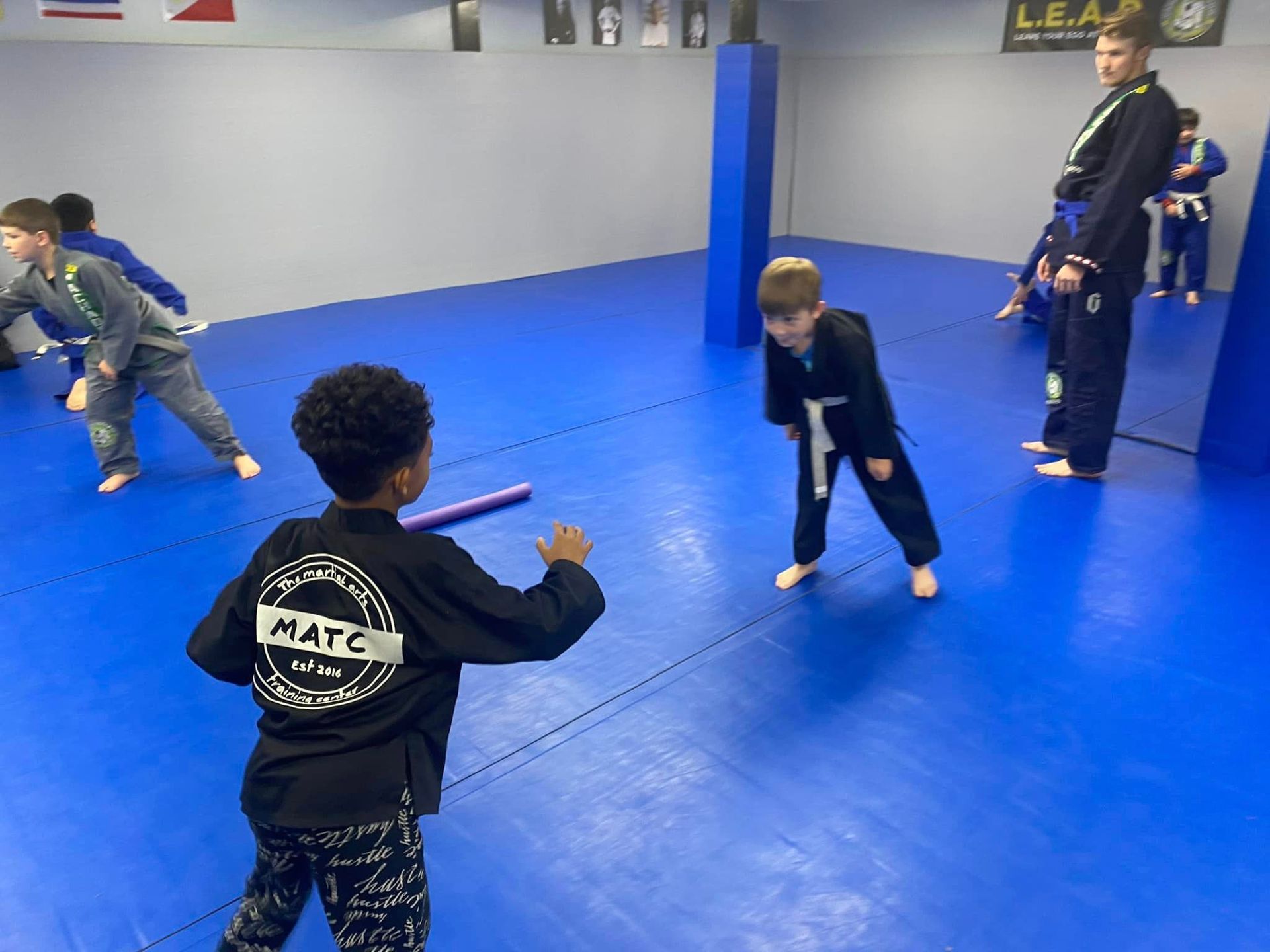Kids in action during a martial arts grading event