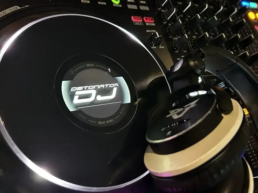 A group of people are dancing with their arms in the air