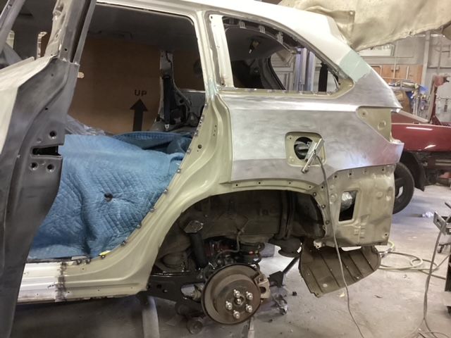 A car is being worked on in a garage