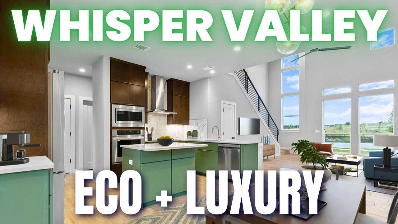 Modern kitchen with green island, stainless steel appliances, and large windows. Text: Whisper Valley Eco + Luxury.
