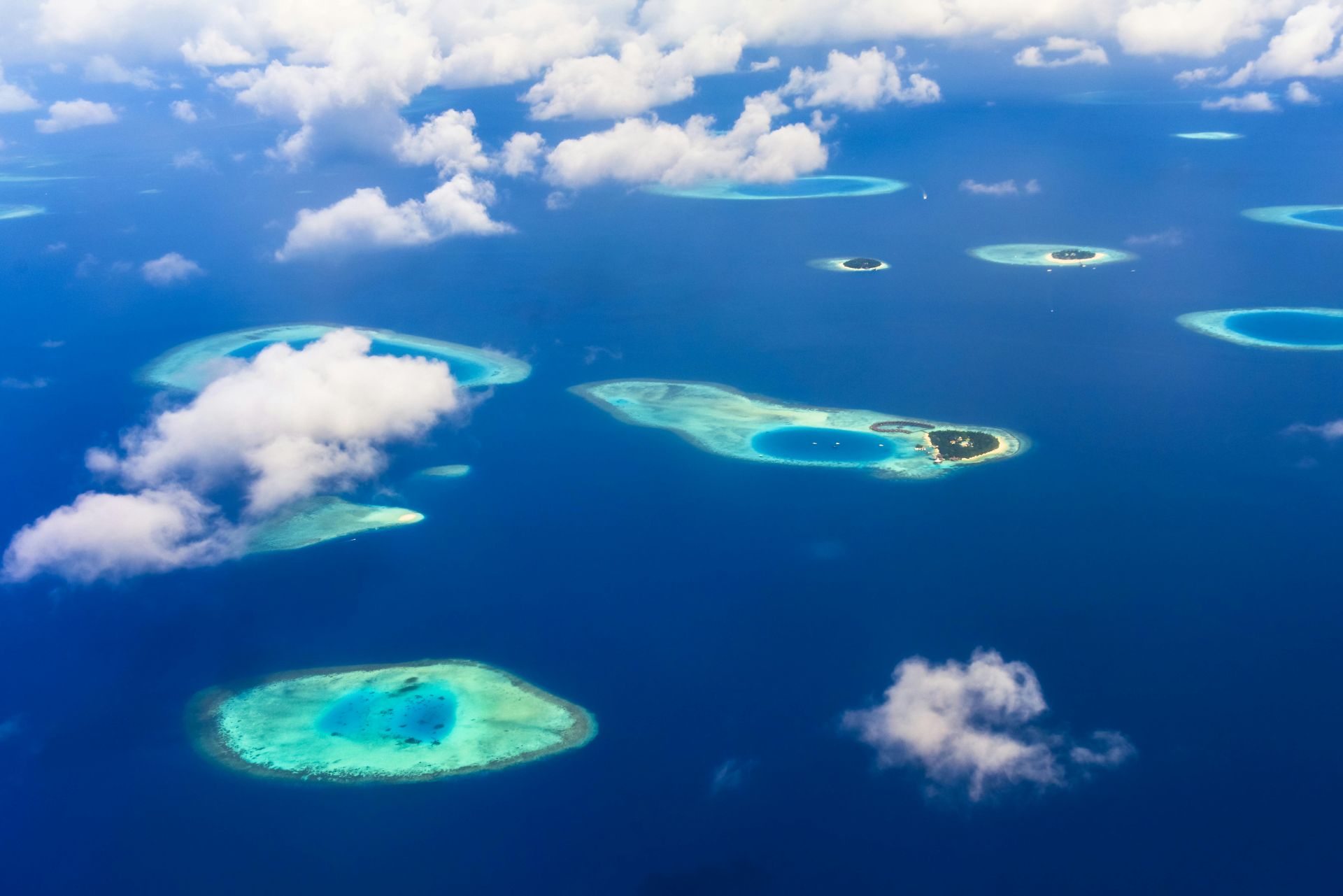 An aerial view of a group of islands in the middle of the ocean.
