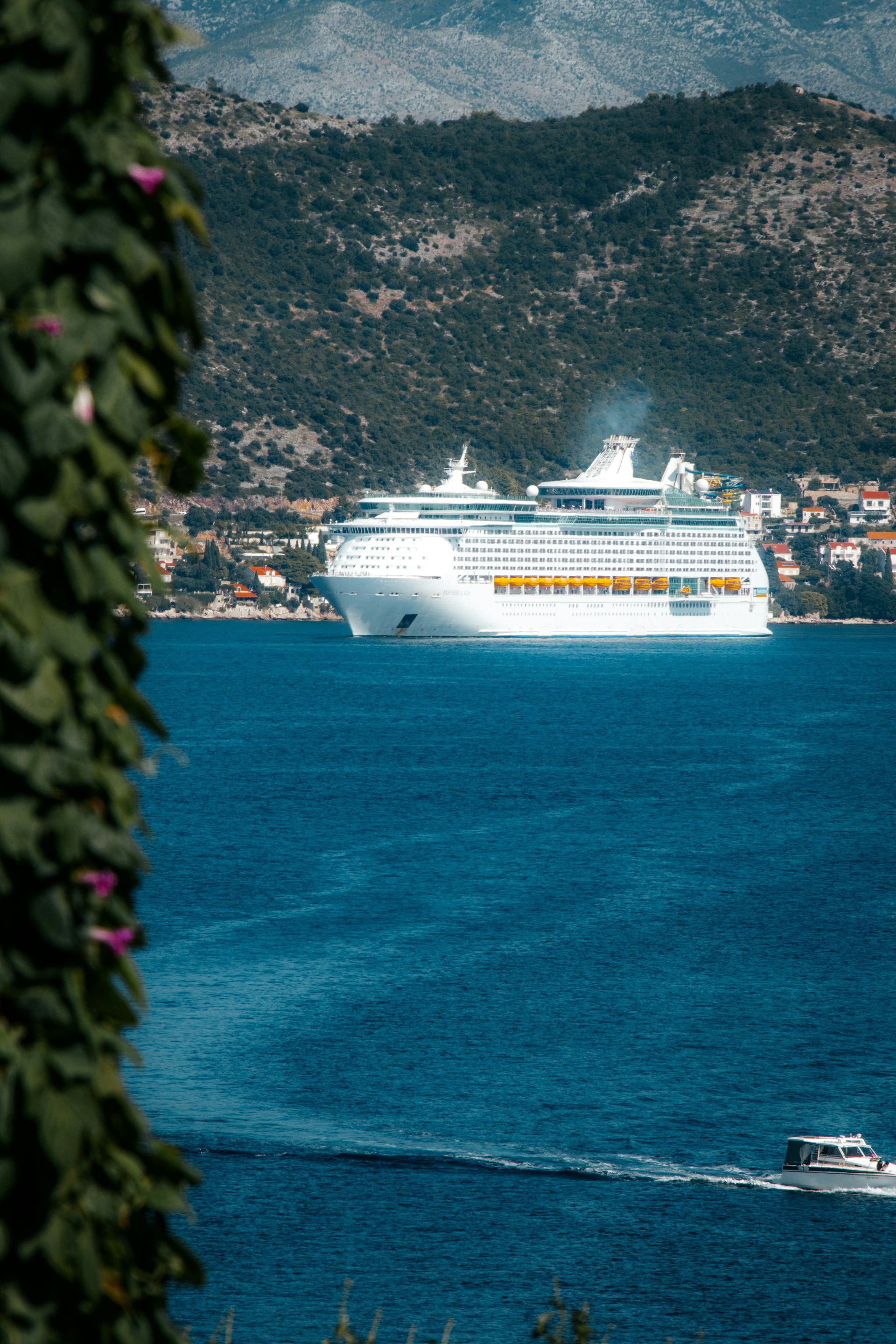 A cruise ship is floating on top of a body of water.
