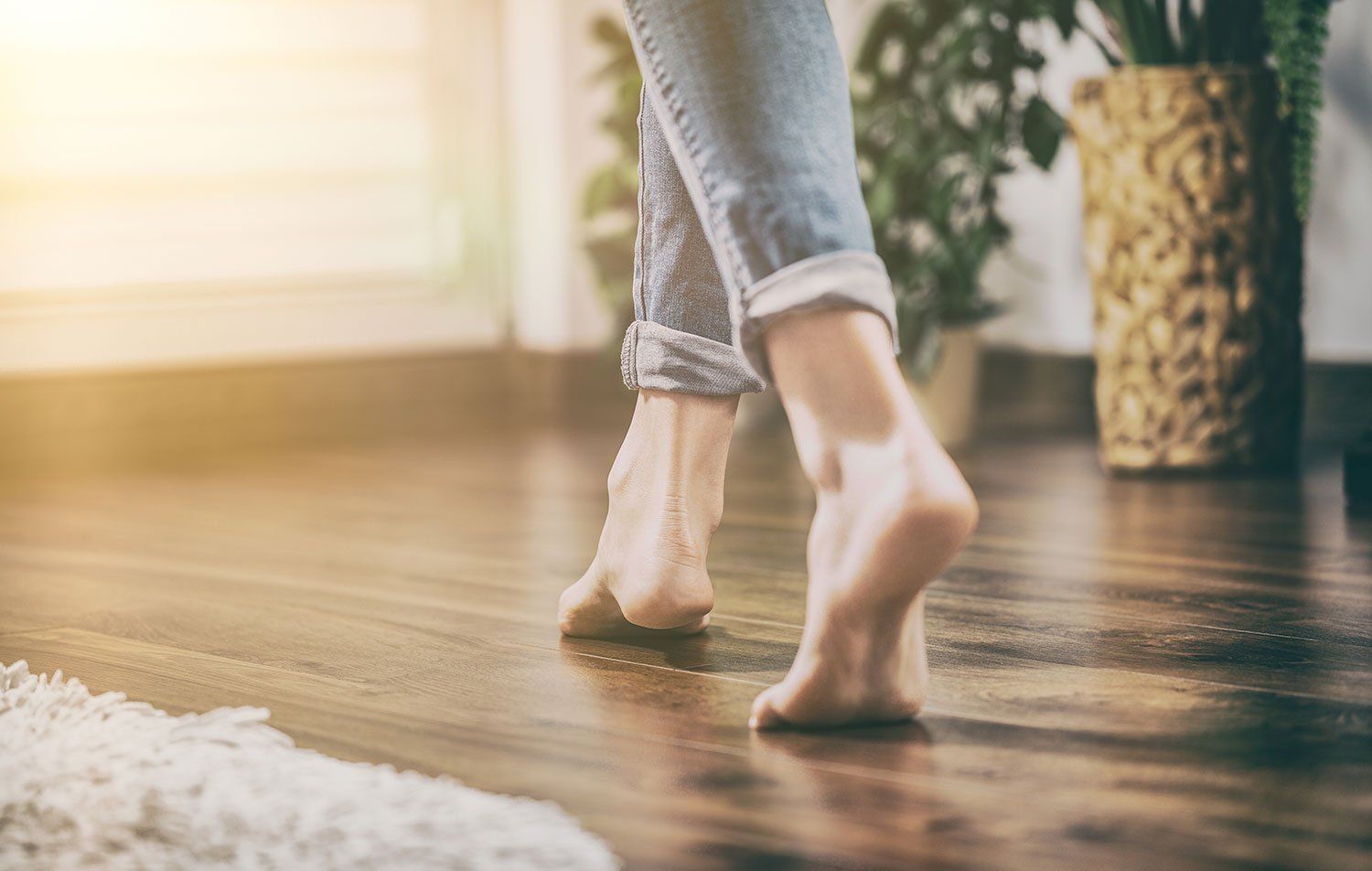 women walking a long a wooden floor