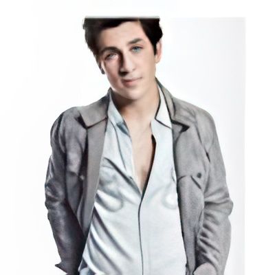 A young man wearing a grey jacket and a white shirt