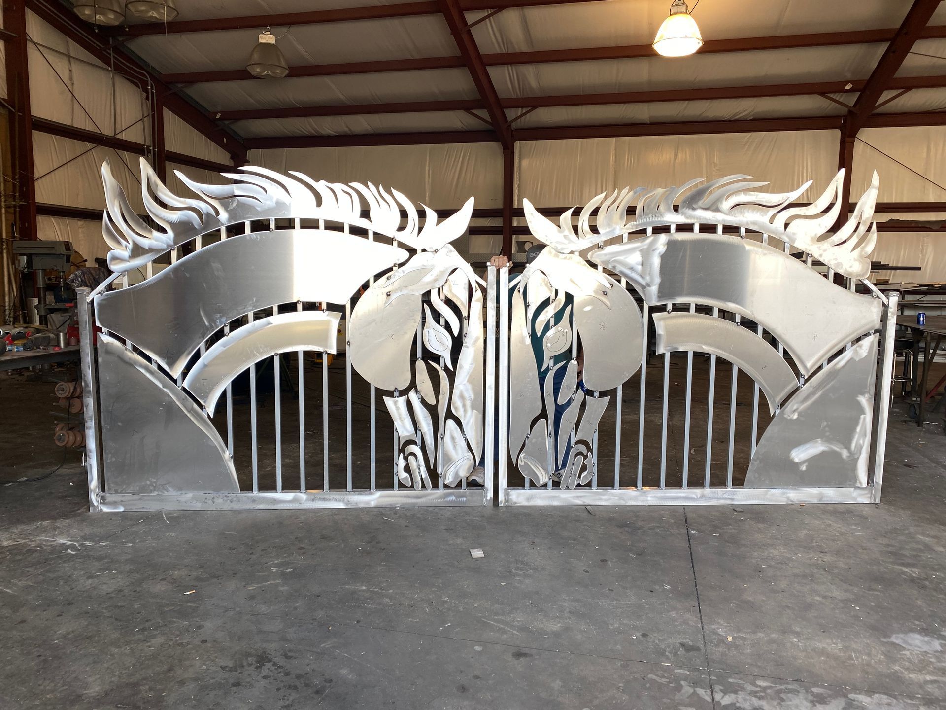A metal gate with a horse head on it