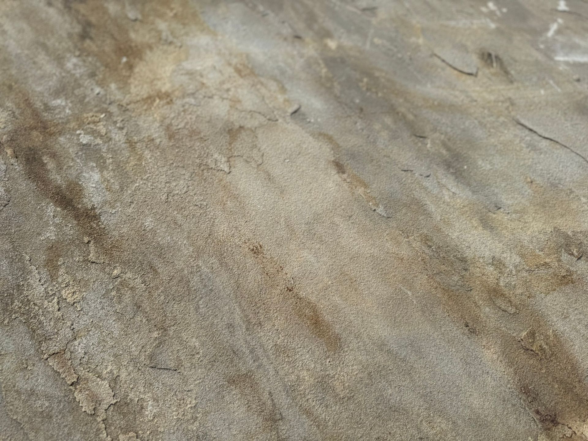 A close up of a dirty concrete surface.