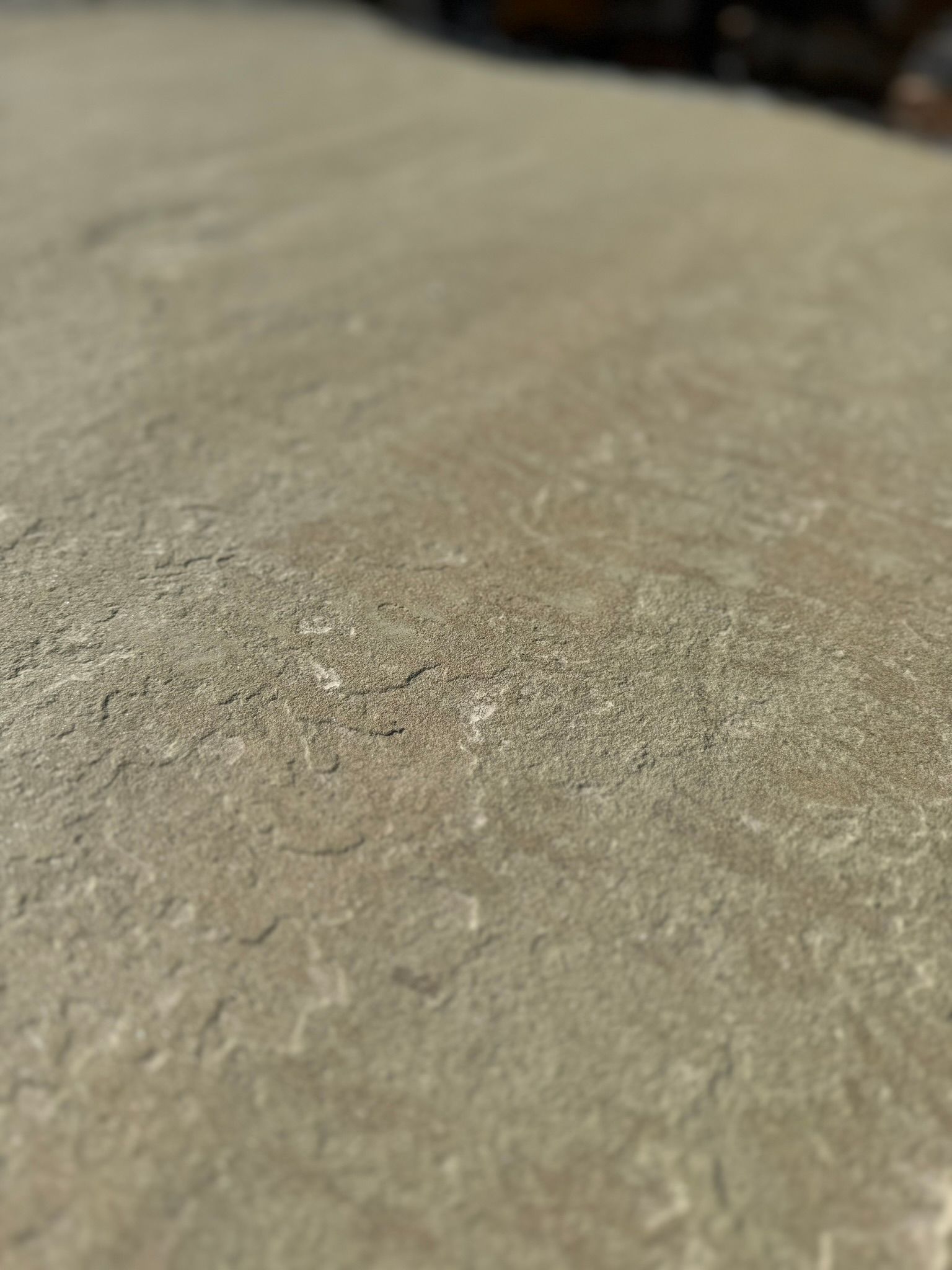 A close up of a piece of concrete on a table.