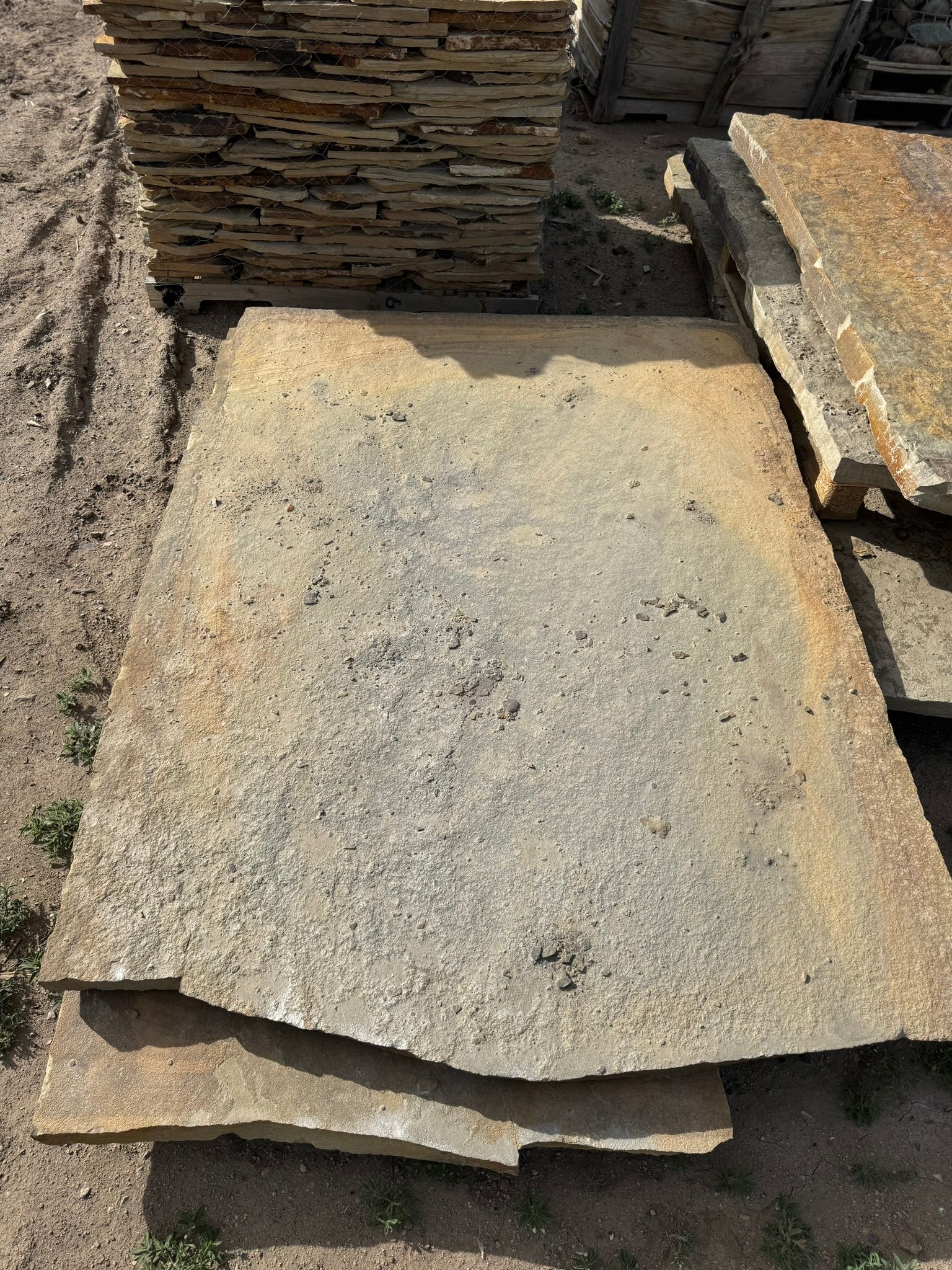 A pile of rocks sitting on top of each other on the ground.