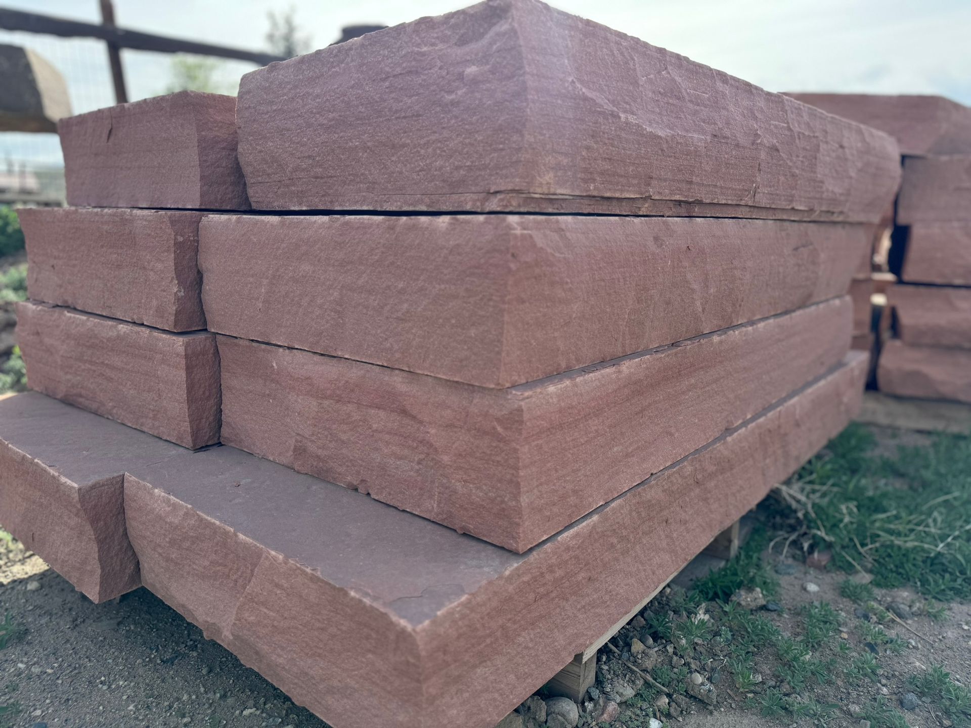 A pile of bricks are stacked on top of each other