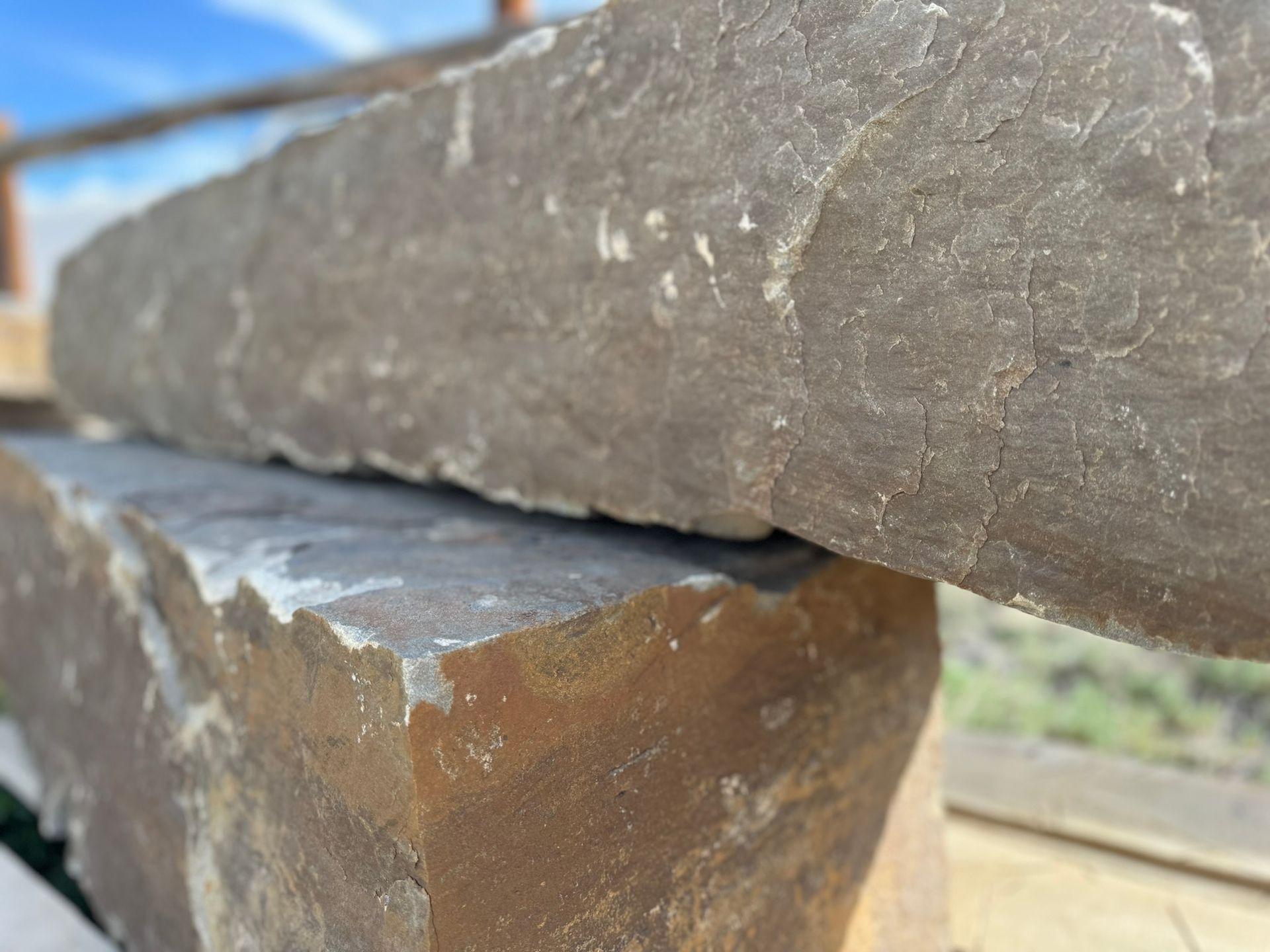A close up of two large rocks stacked on top of each other.