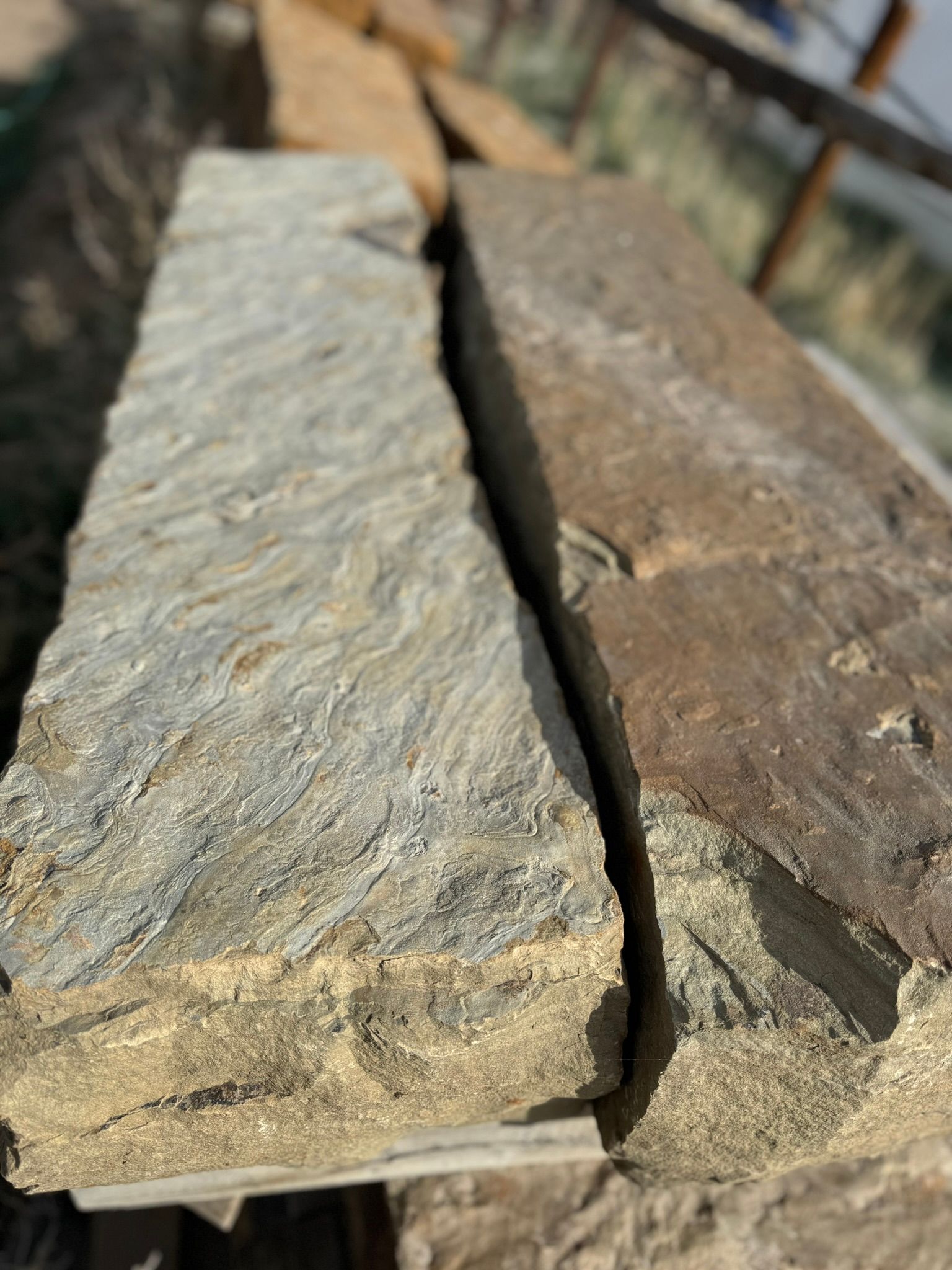 A close up of two pieces of stone sitting on top of each other.