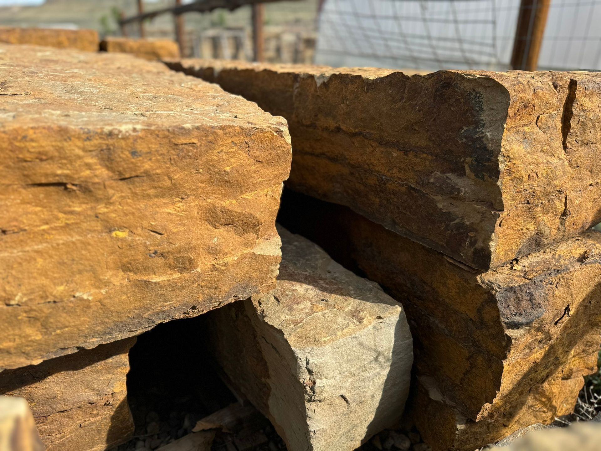 A pile of rocks with a hole in the middle of one of them.