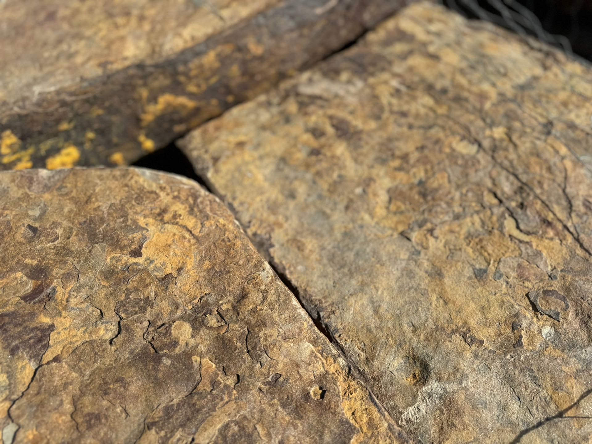 A close up of a pile of rocks sitting on top of each other.
