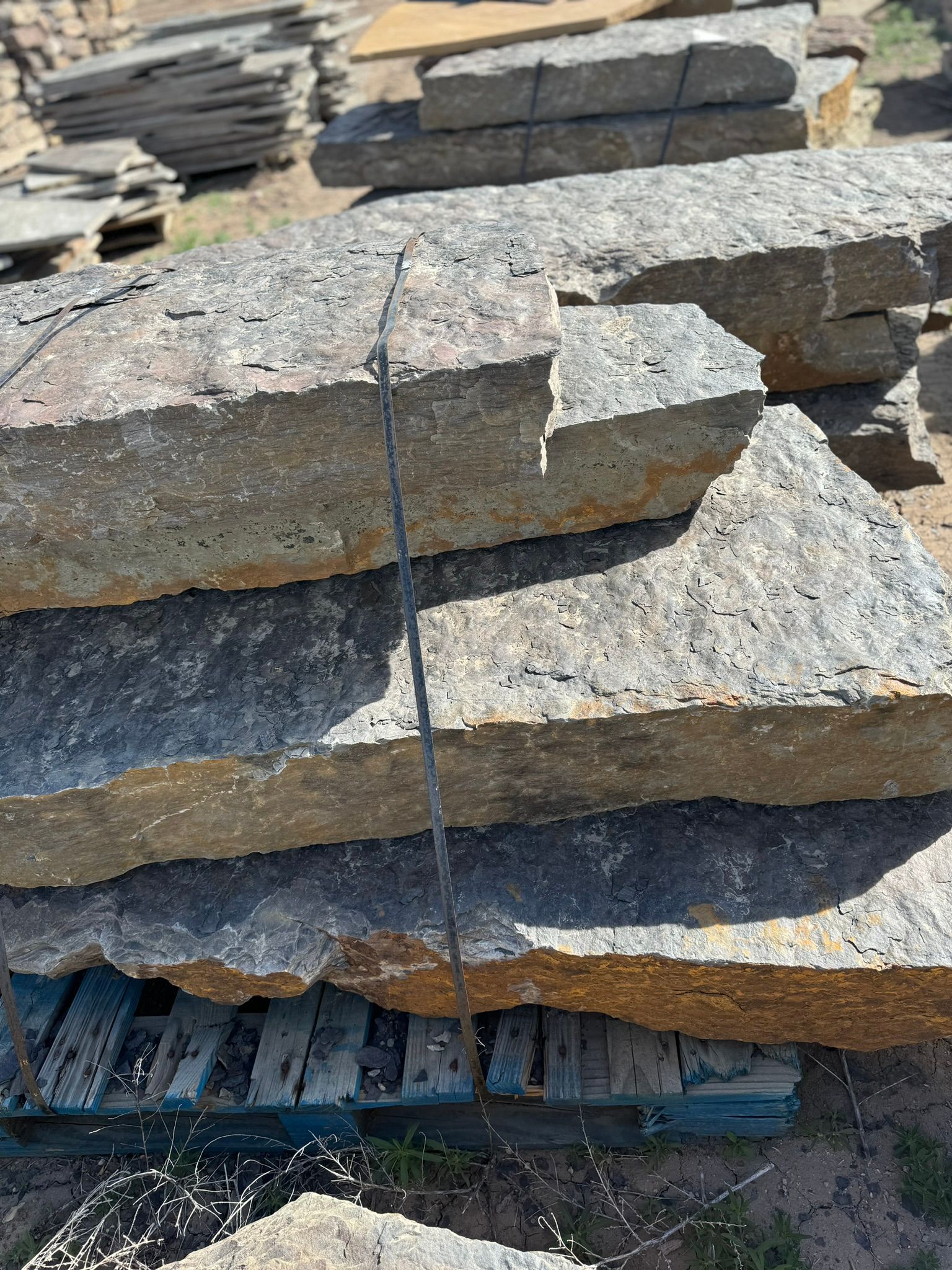 A pile of rocks stacked on top of each other on a pallet.