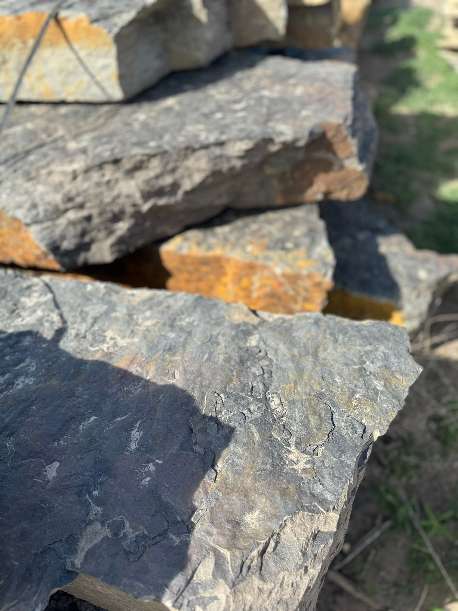 A close up of a pile of rocks sitting on top of each other.