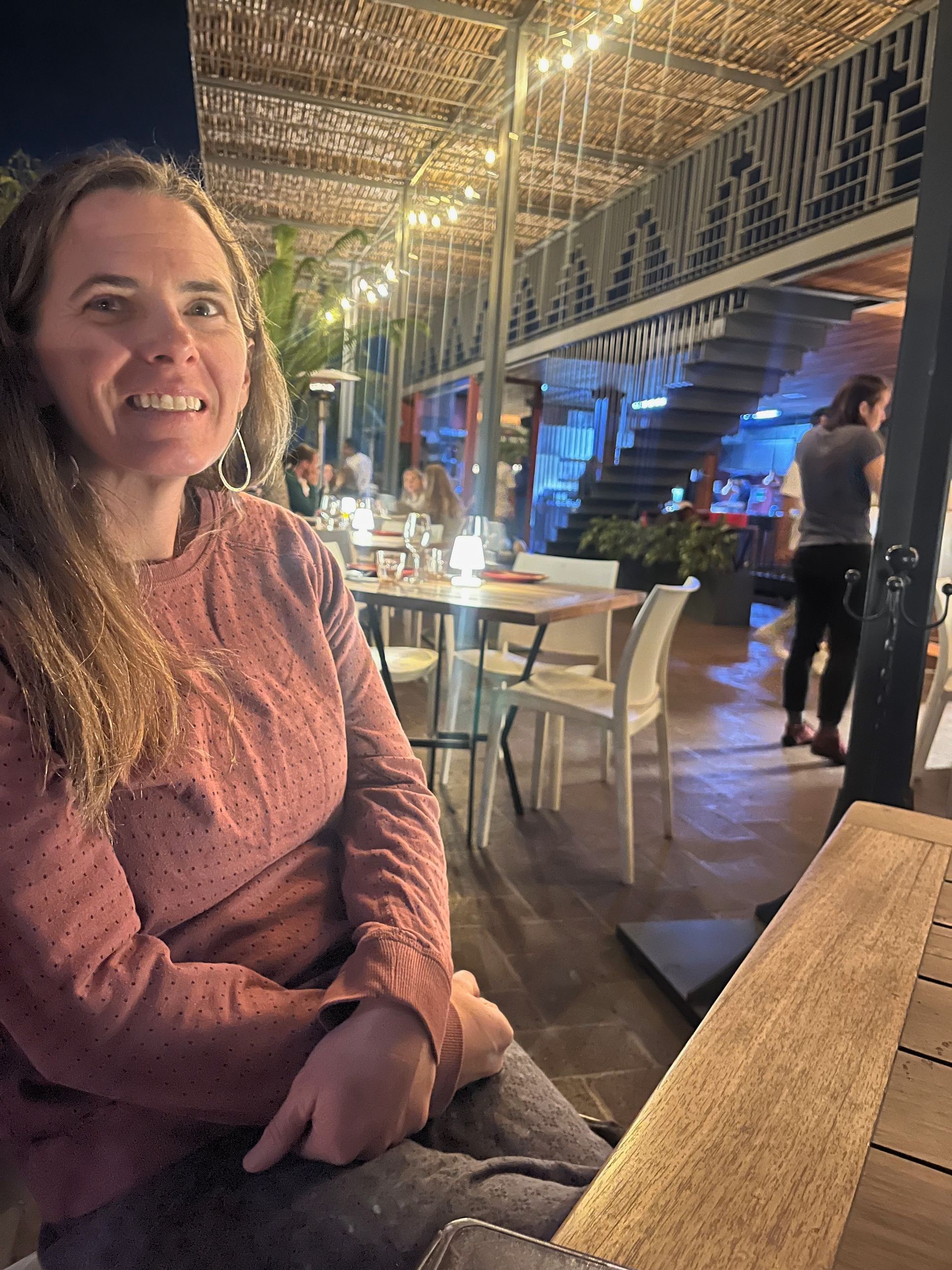 a person is riding a mountain bike down a dirt trail .