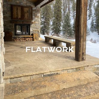 a patio with a fireplace and a bench with the words flatwork above it