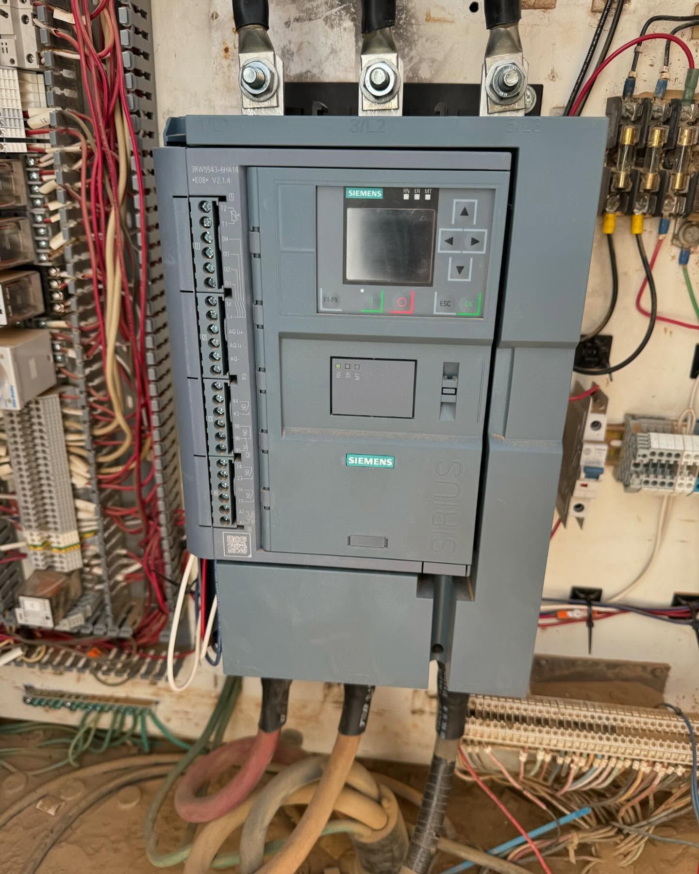 Siemens industrial control panel with wiring in an electrical cabinet.