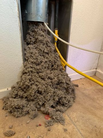 Man Cleaning A Dryer Filter — Murrieta, CA — Southern California Dryer Vent Cleaning