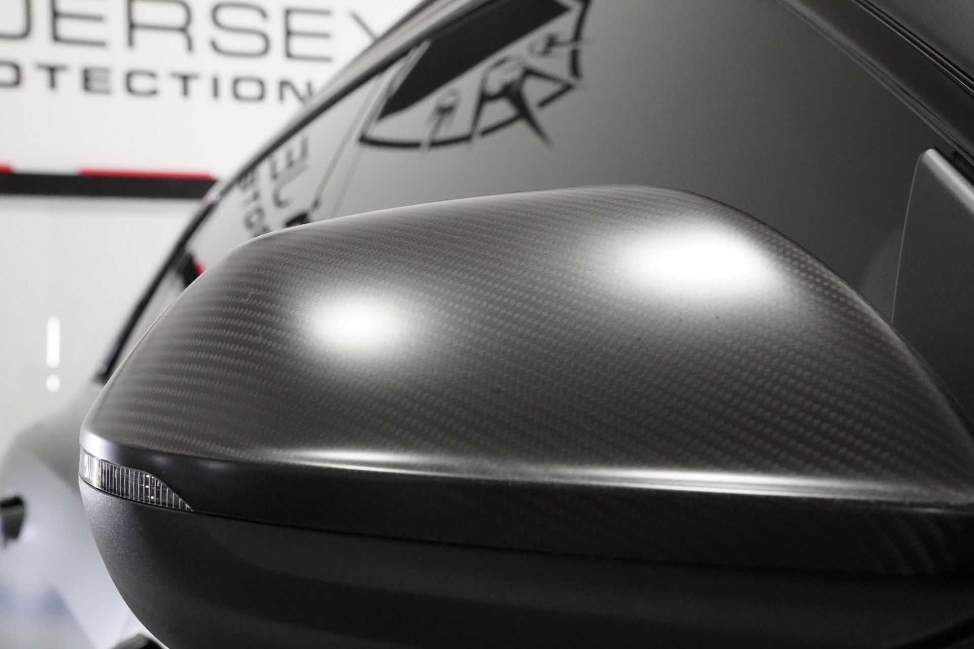 A close up of a rear view mirror on a car