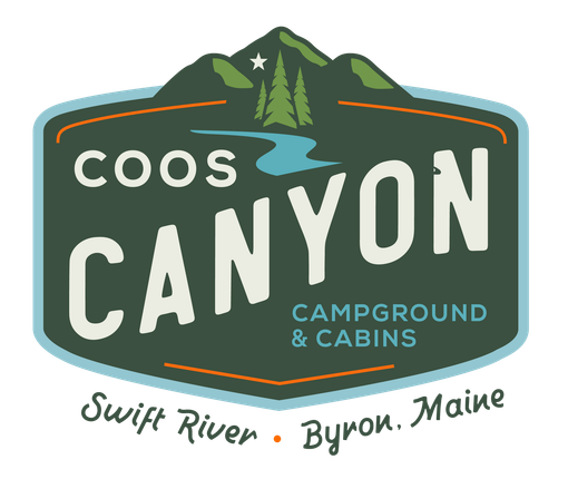 The logo for coos canyon cabins and campground.
