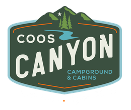 The logo for coos canyon cabins and campground