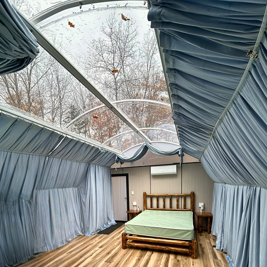 The trees are green and the river is blue.