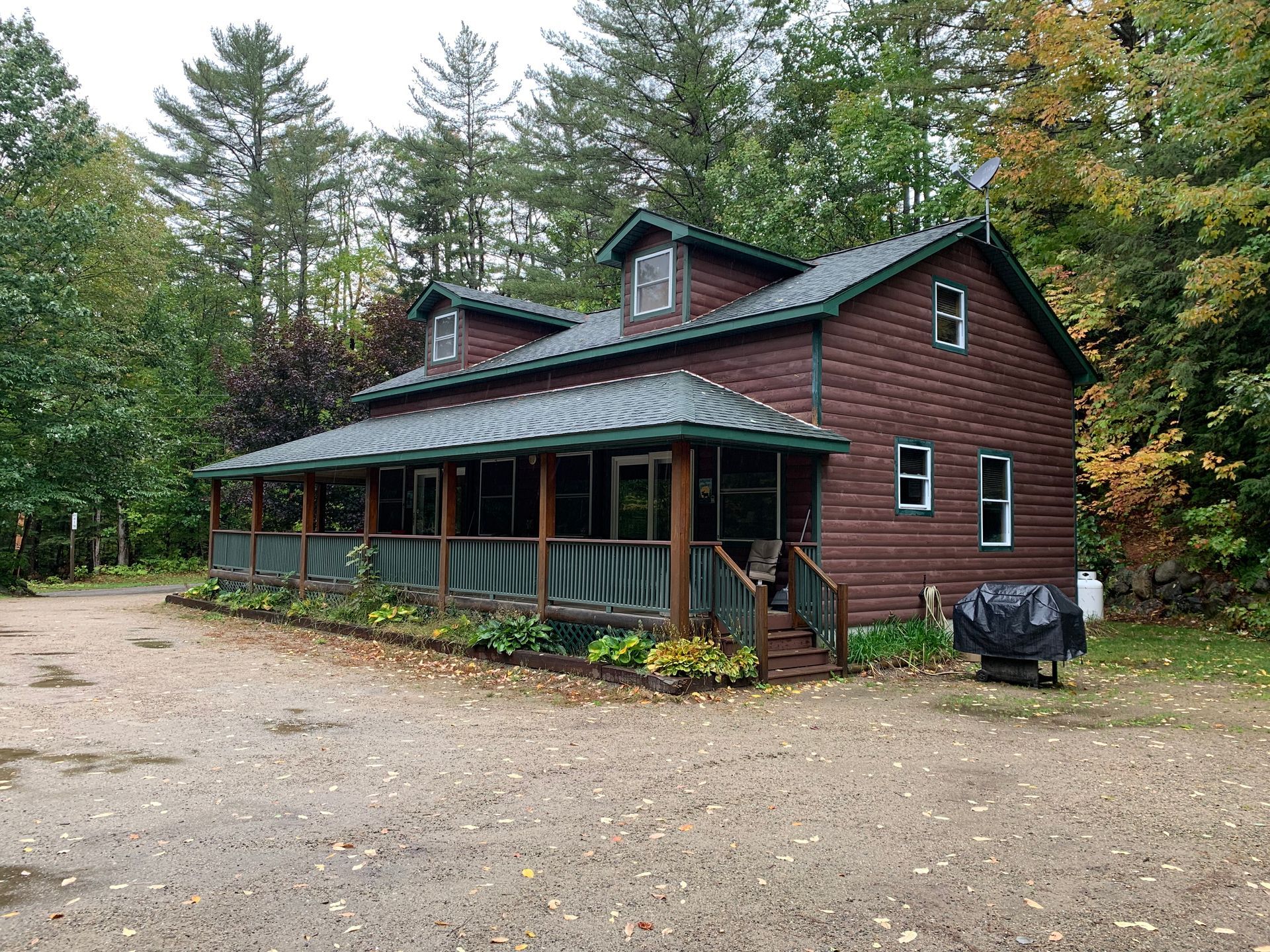 Coos Canyon Campground office with porch in the middle of a forest