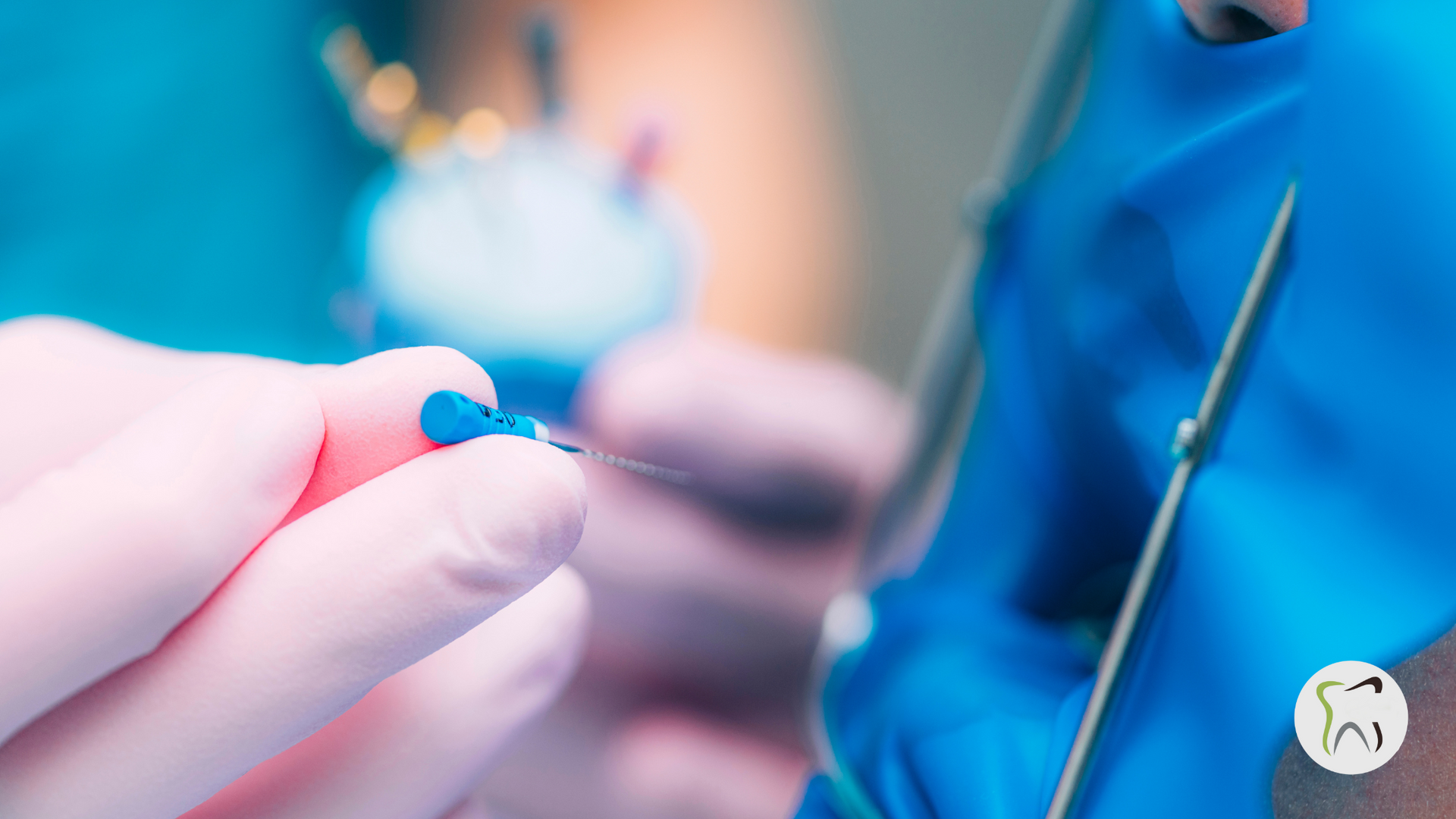 A close up of a person holding a blue object in their hand.