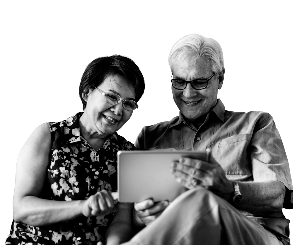 Smiling couple looking at a tablet together. Smiling couple looking at a tablet together.