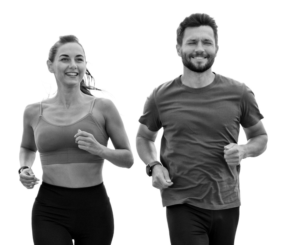 Woman and man running together, smiling. Woman and man running together, smiling.