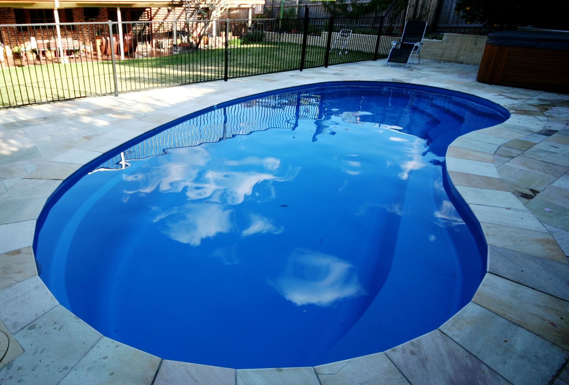 A Pool With A Fence Around It - In Ground Pools in Nowra, NSW
