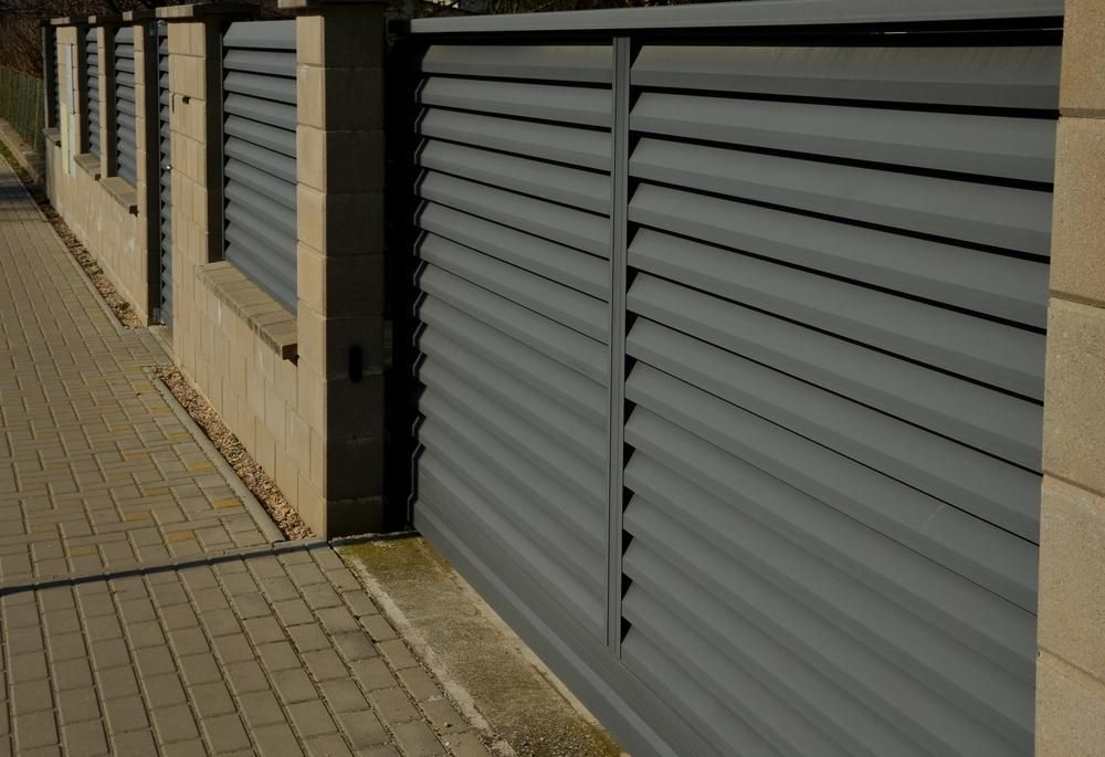 A Fence with A Sliding Gate and Brick Pillars — Quality Fencing Solutions in Ballina, NSW