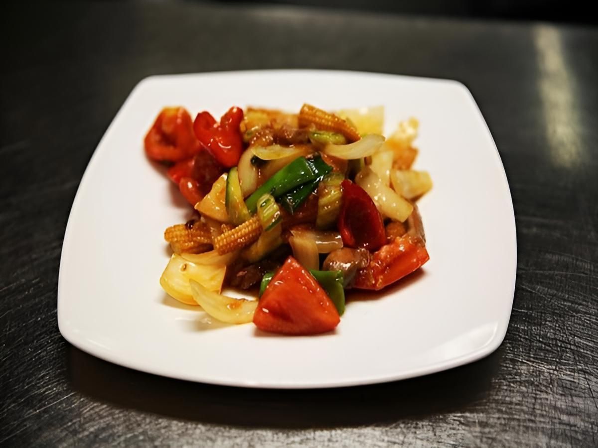 A White Plate Topped With Vegetables On A Table — Mod Thai Nelson Bay In Nelson Bay, NSW