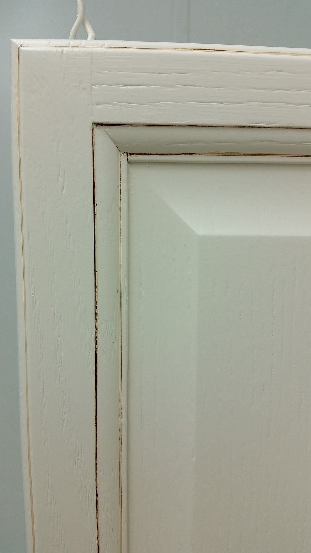Close Up of Cabinet Door Repainted cream with Antique finishing