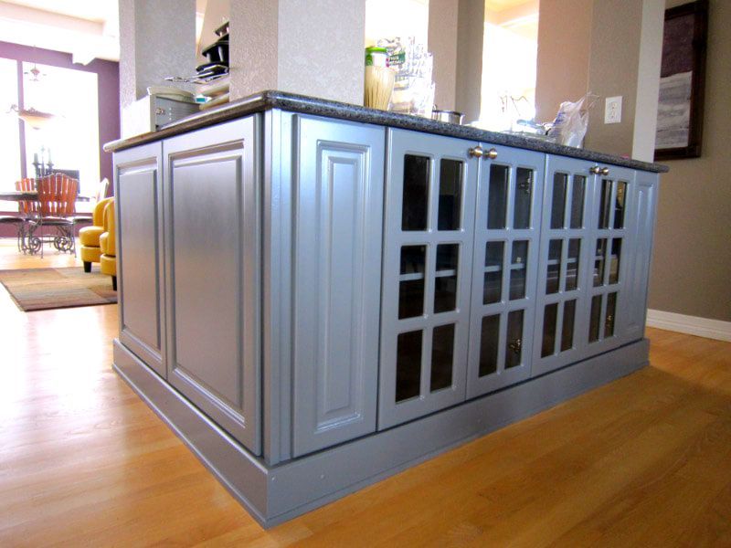 Blue Painted Kitchen Island with Glass Doors