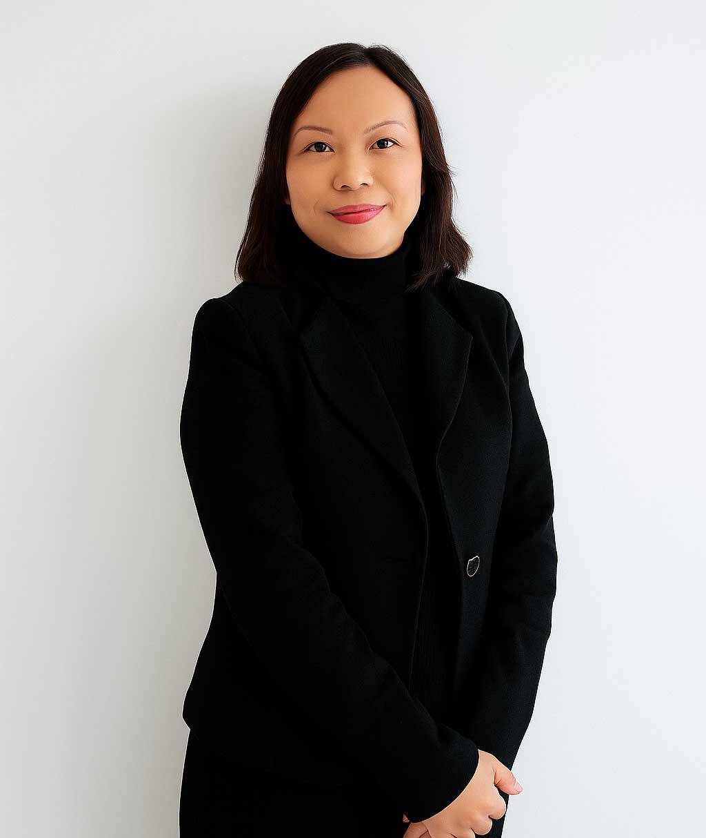 A woman with dark hair wearing a black blazer