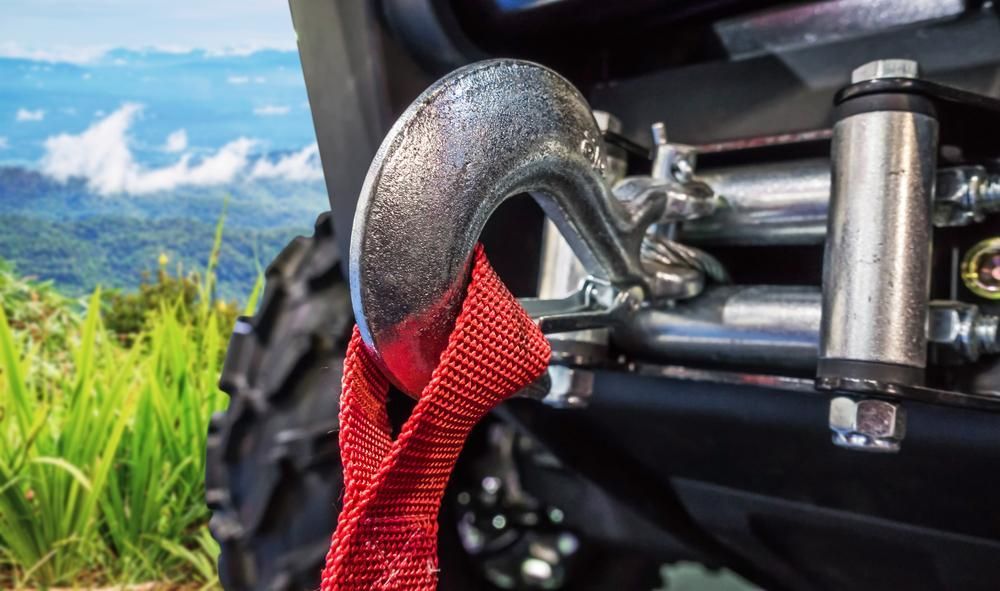 A Close Up of a Winch Hook With a Red Rope Attached to It — Ballina Bearing Supplies In Byron, NSW