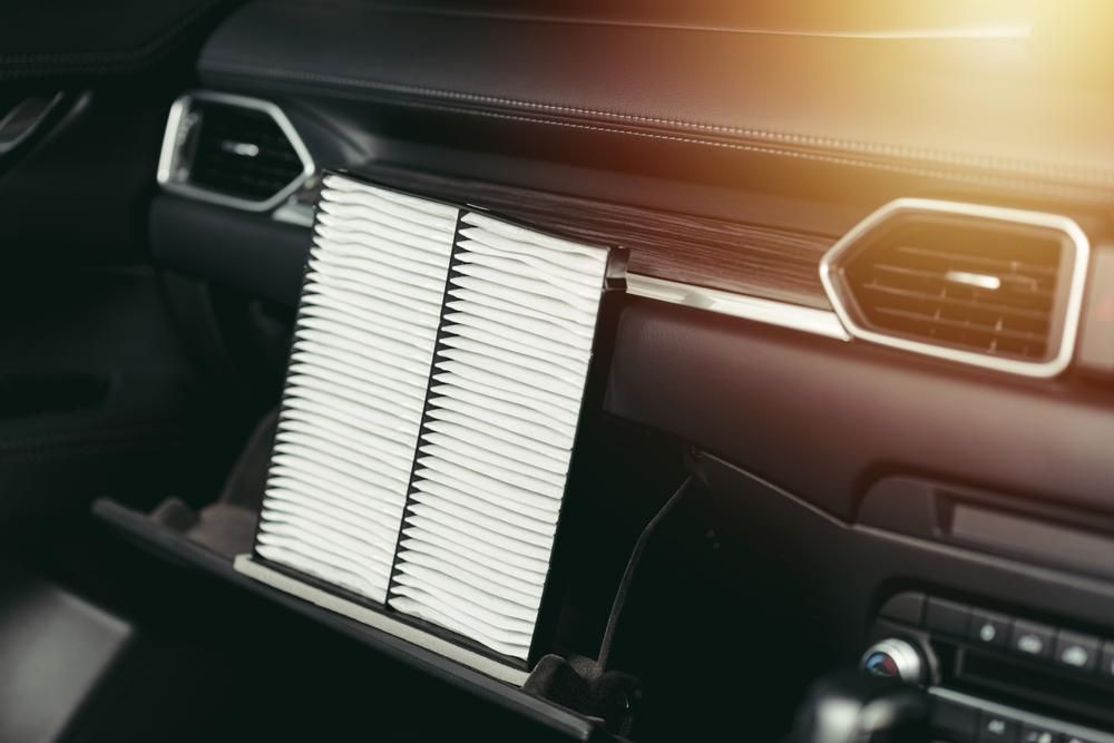 A Car Air Filter is Sitting in the Glovebox of a Car — Ballina Bearing Supplies In Grafton, NSW
