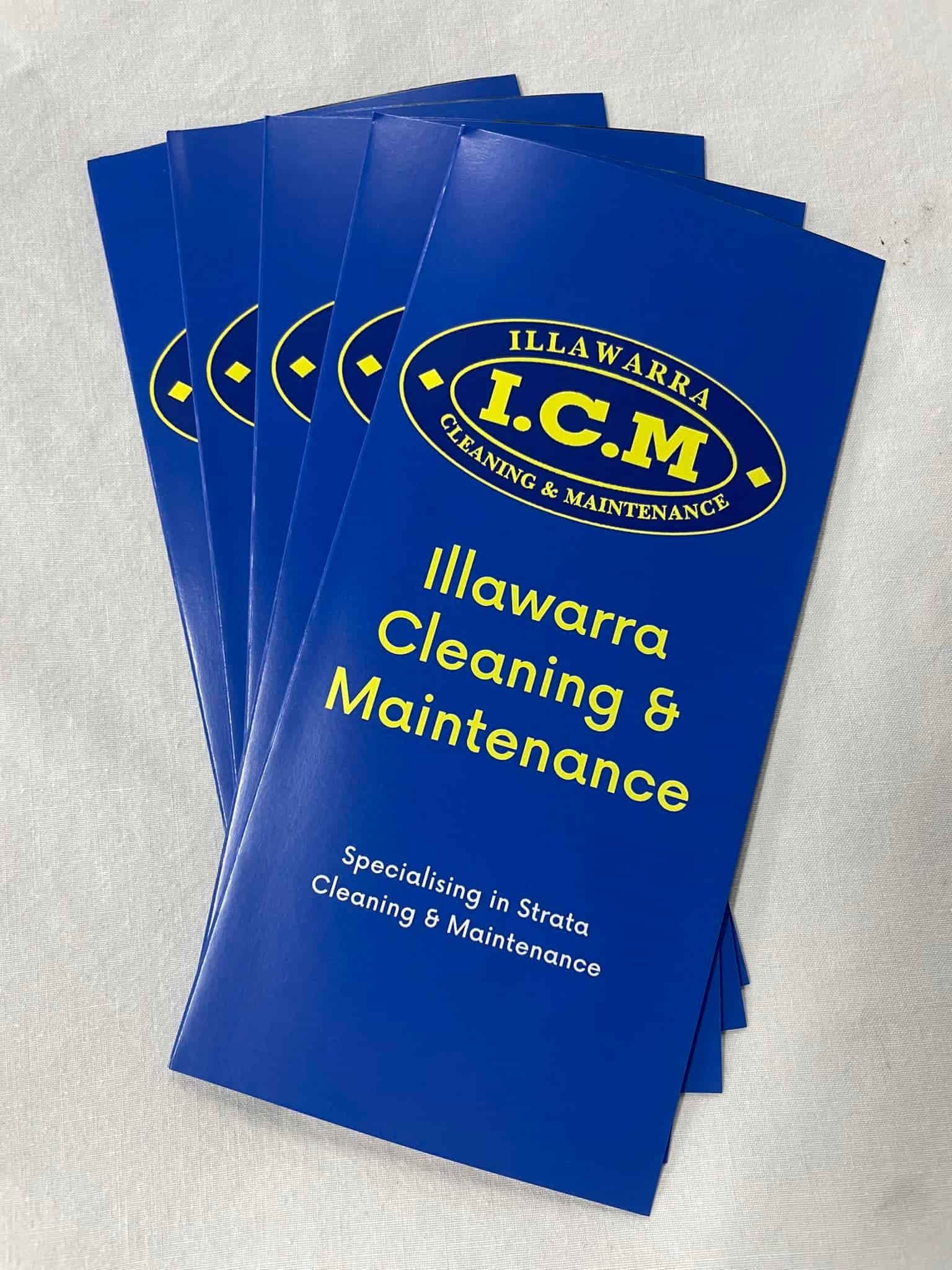 A Stack Of Blue Brochures For I.C.M Cleaning And Maintenance — Illawarra Cleaning & Maintenance In Dapto, NSW