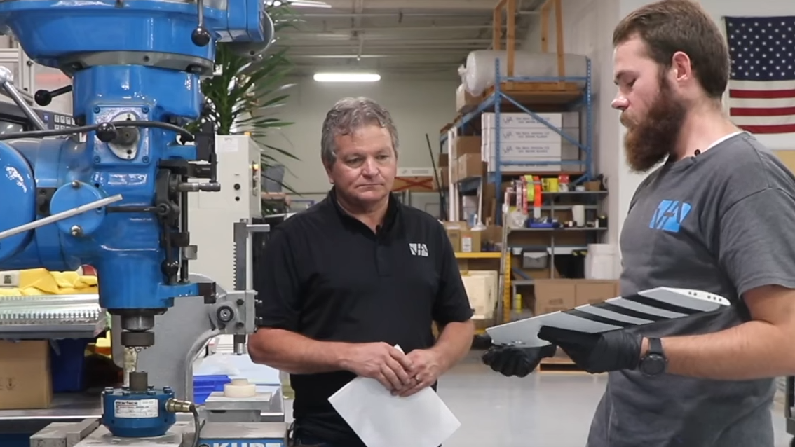 VHA employees use drill press to swage 206 tail rotor blade bearings.