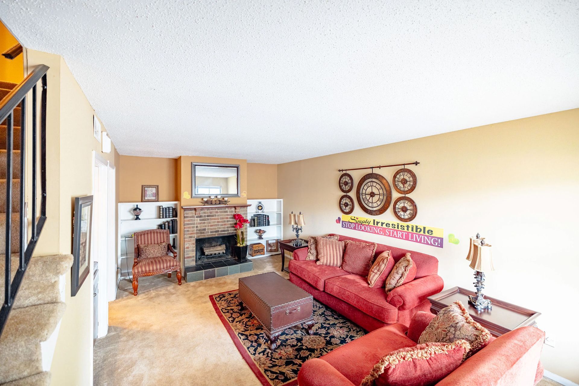 A living room filled with furniture and a fireplace.