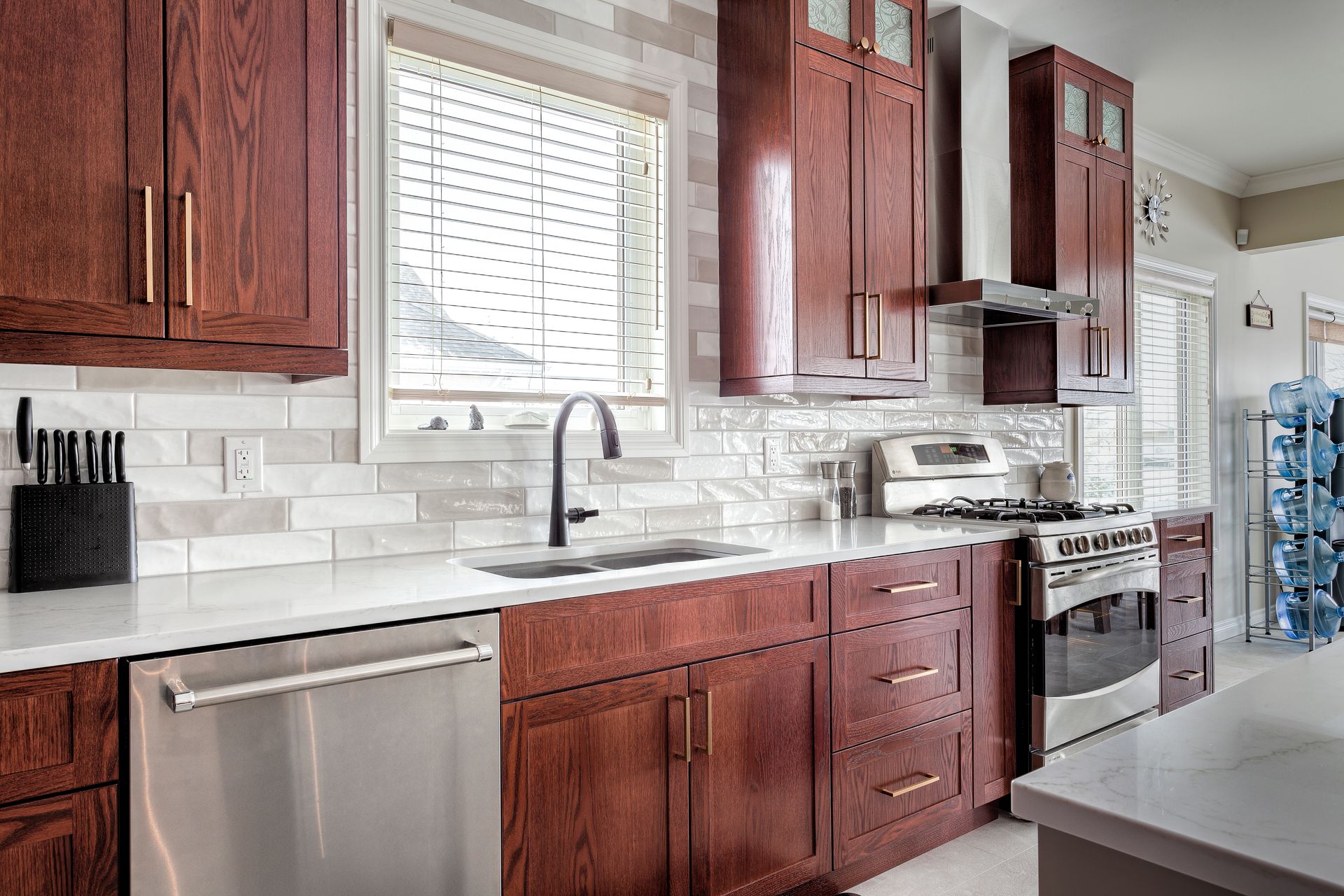A kitchen with wooden cabinets and stainless steel appliances.