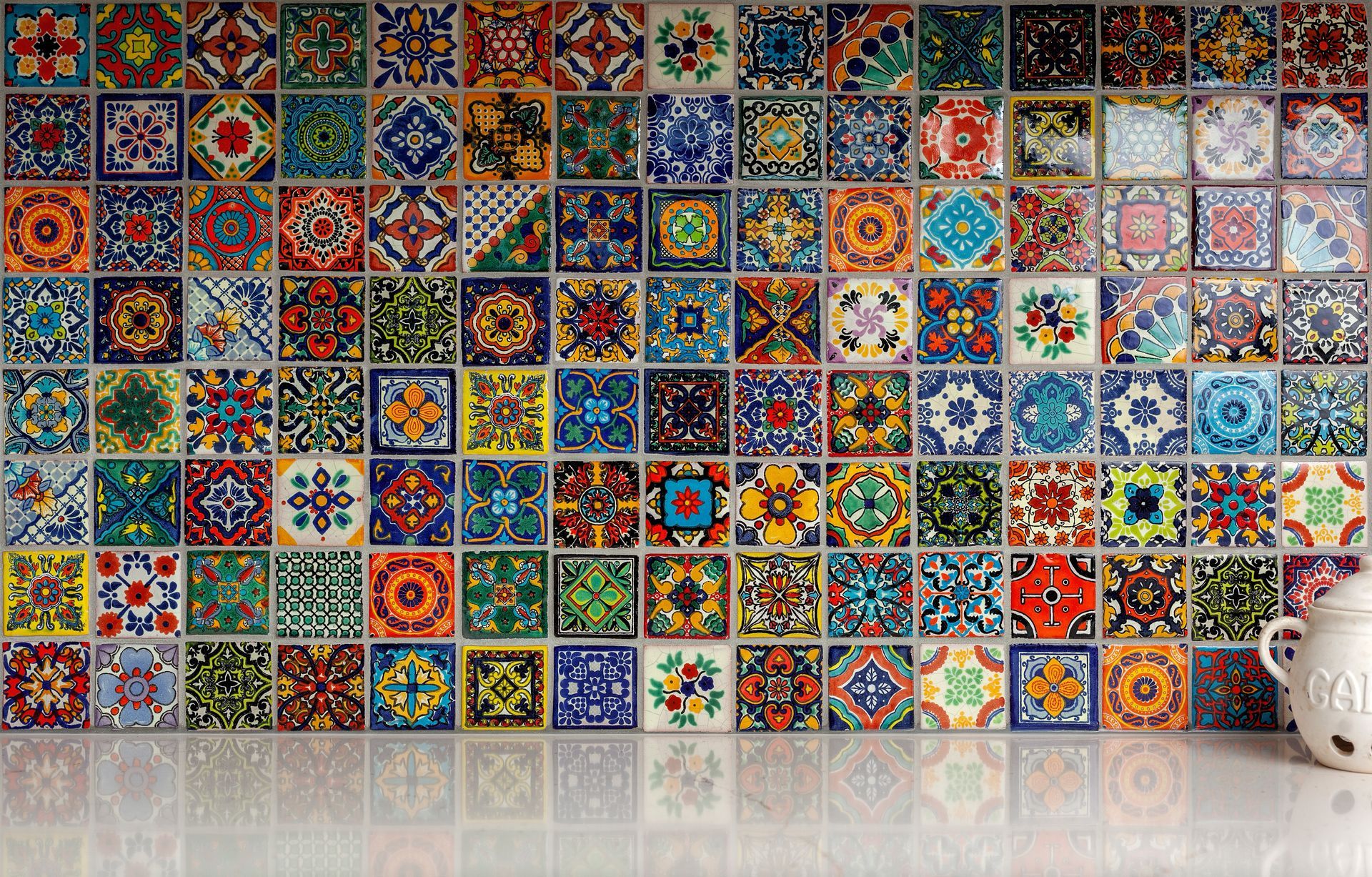 There are many different types of tiles on the wall.