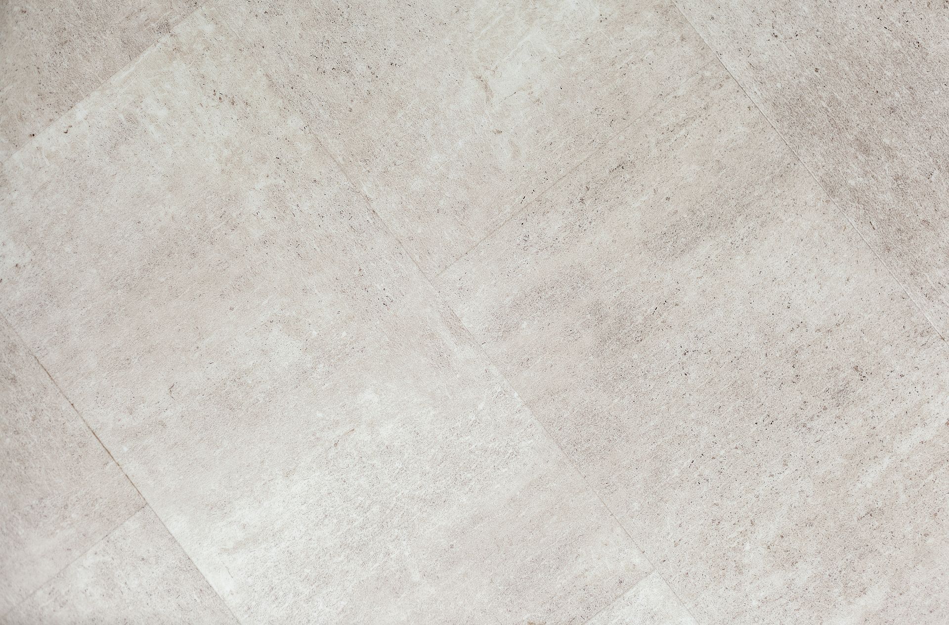 A close up of a white tile floor texture.