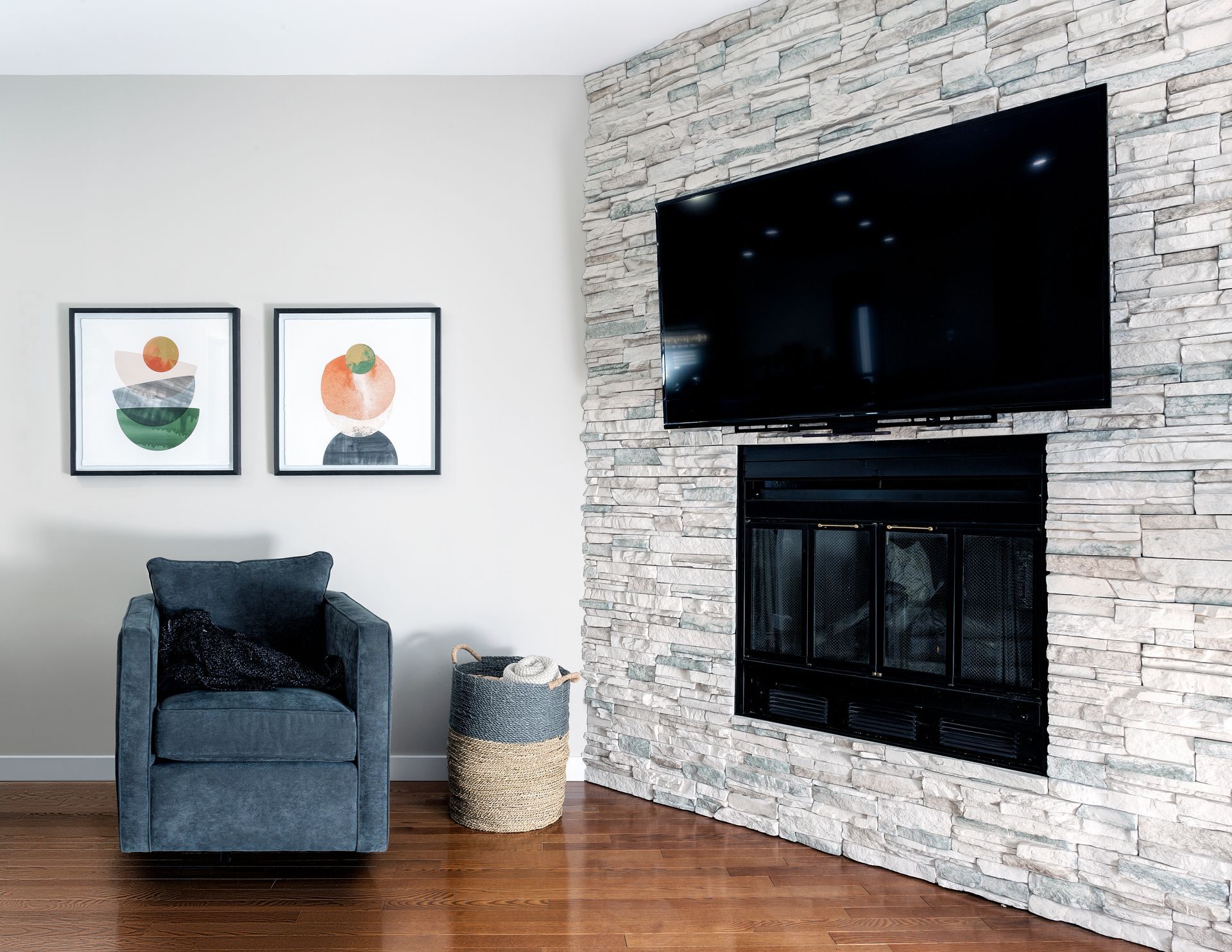 a living room with a fireplace and a flat screen tv on the wall .