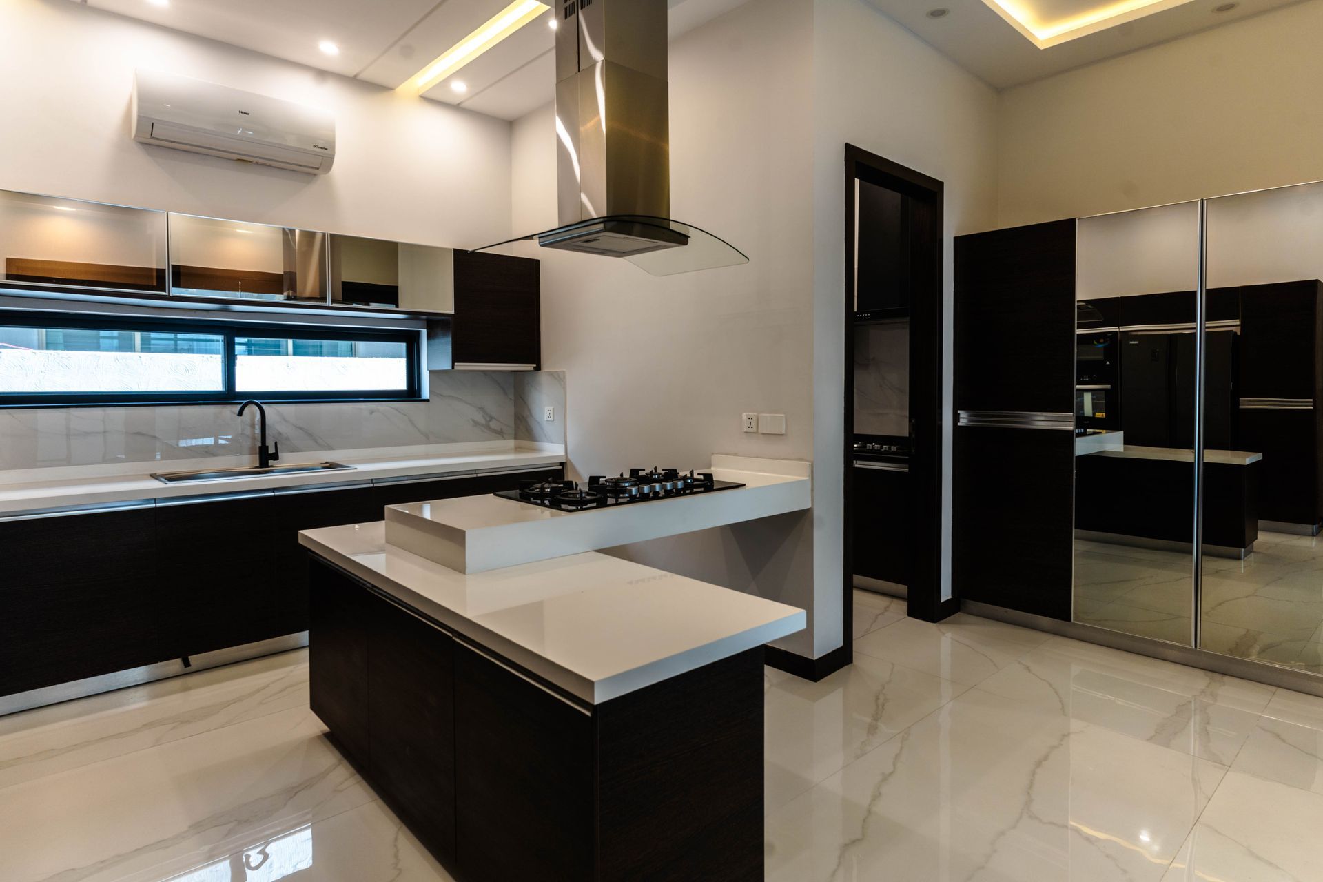 A kitchen with a large island in the middle of the room.