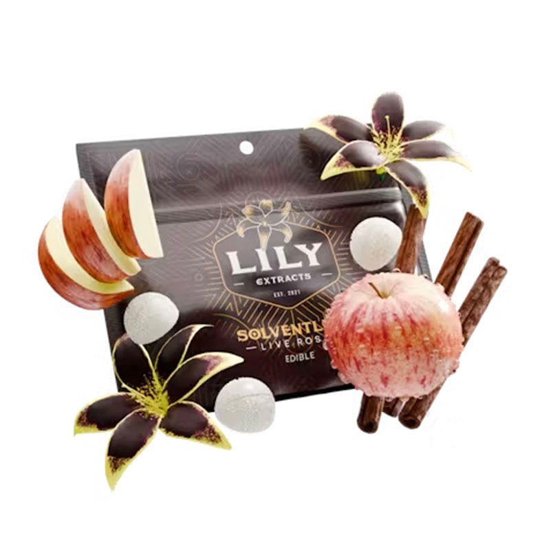 A bag of lily extracts edibles with apples and cinnamon sticks.