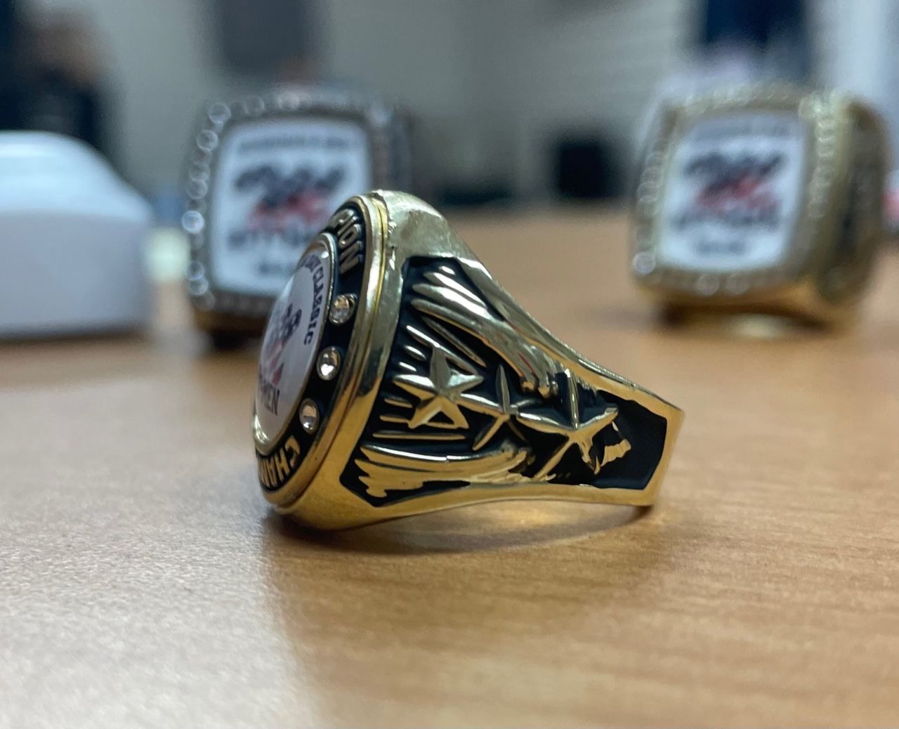 A close up of a gold ring on a table